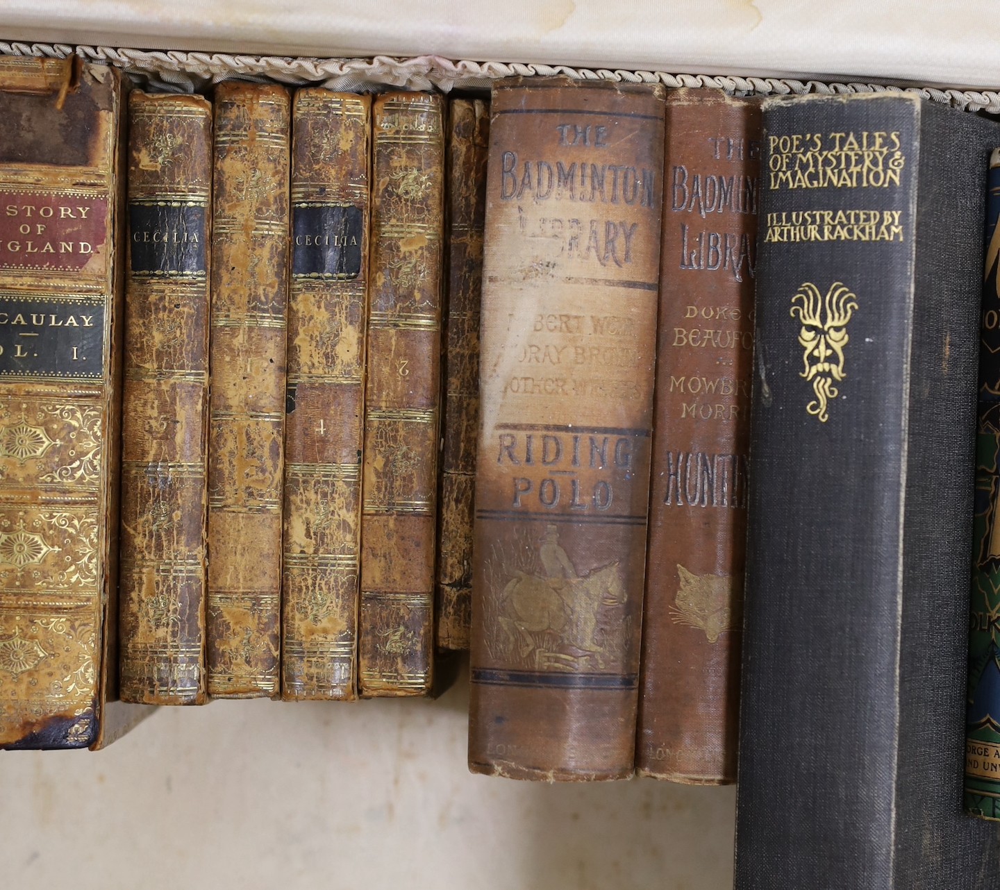 A quantity of leather bound books and a J R R Tolkein volume of The Hobbit with original dust jacket